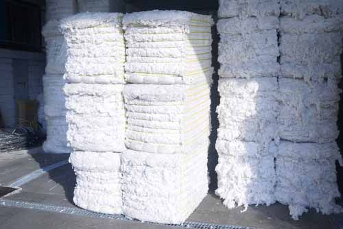 Cotton is piled up at a warehouse